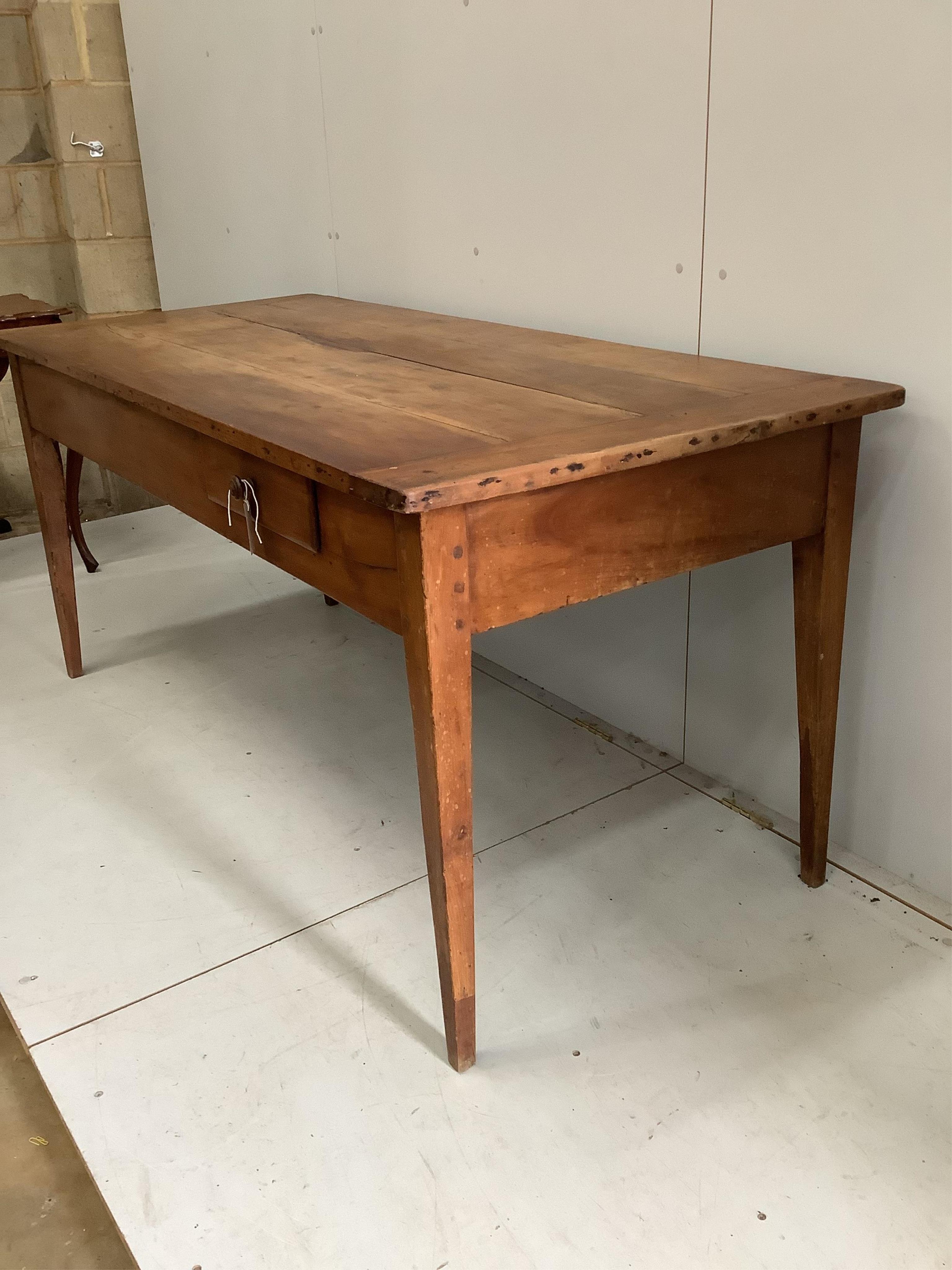 A late 19th century French cherrywood kitchen table with two drawers, width 170cm, depth 78cm, height 78cm. Condition - fair